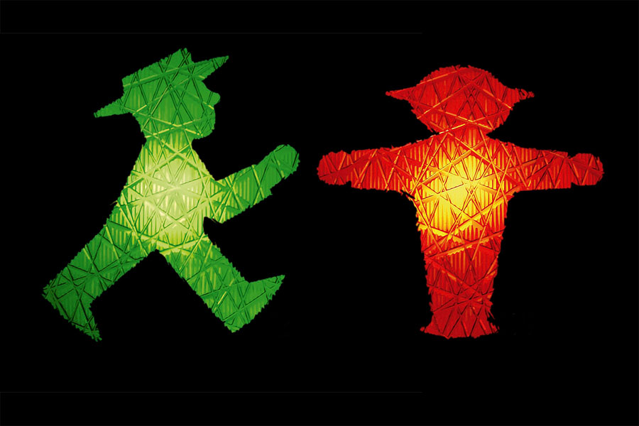 The green and red Ampelmännchen figures against a black background