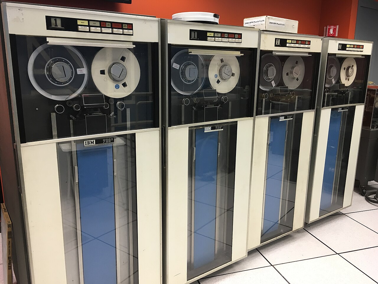 Two restored IBM 729 magnetic tape drives with open glass doors.