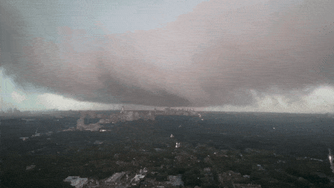 A wide shelf cloud advancing over Toronto, seen from a midtown high-rise