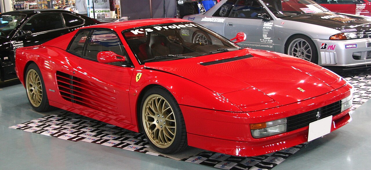 Red 1980s Ferrari Testarossa photographed in profile