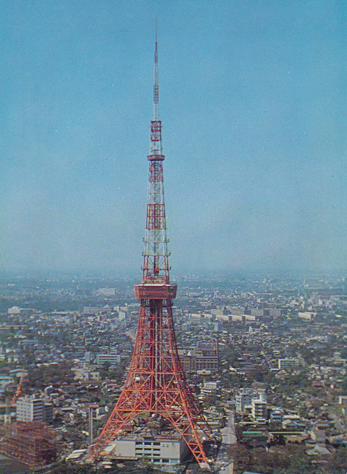 Tokyo Tower rising above the city on a 1960s postcard, finished in 1958.