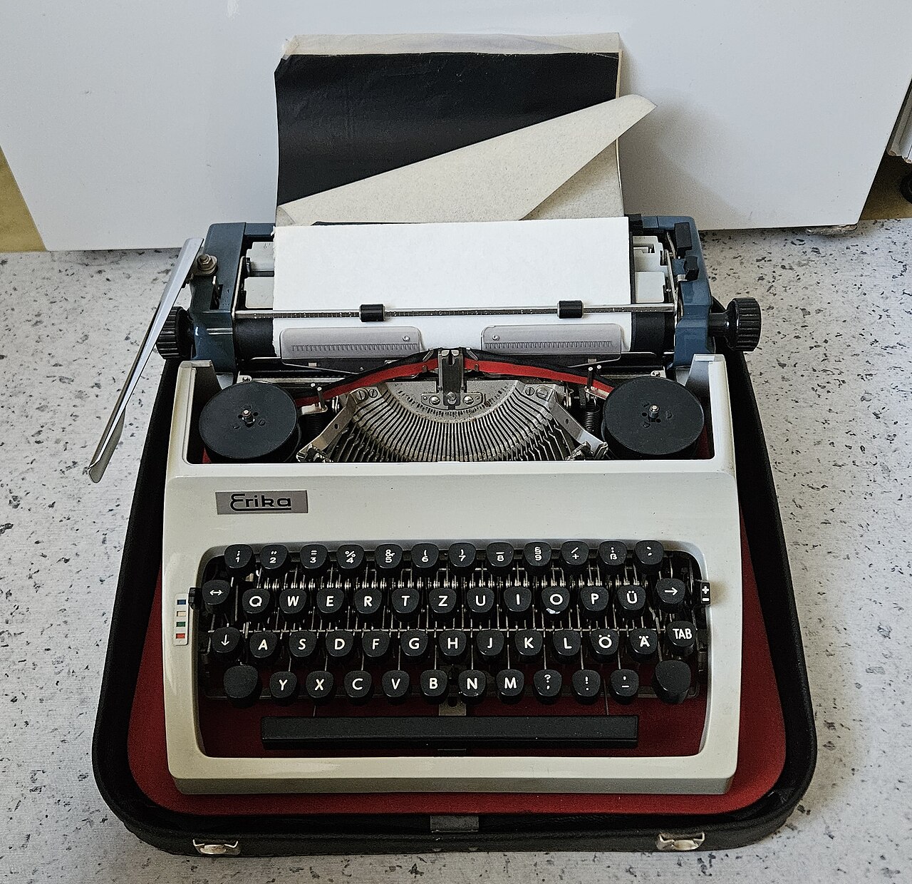 Erika portable typewriter in its case